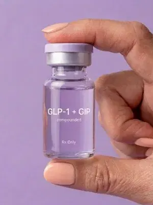 Woman in menopause holding a tirzepatide vial
